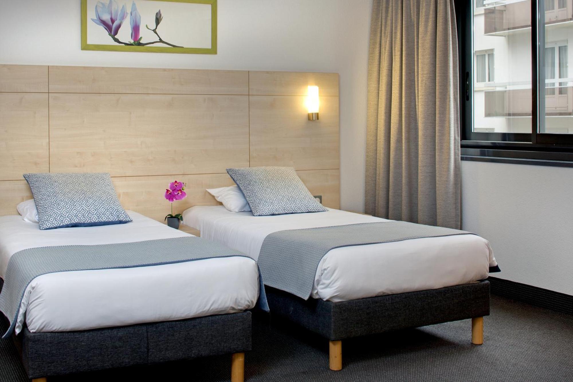 Tweepersoonskamer met 2 Aparte Bedden