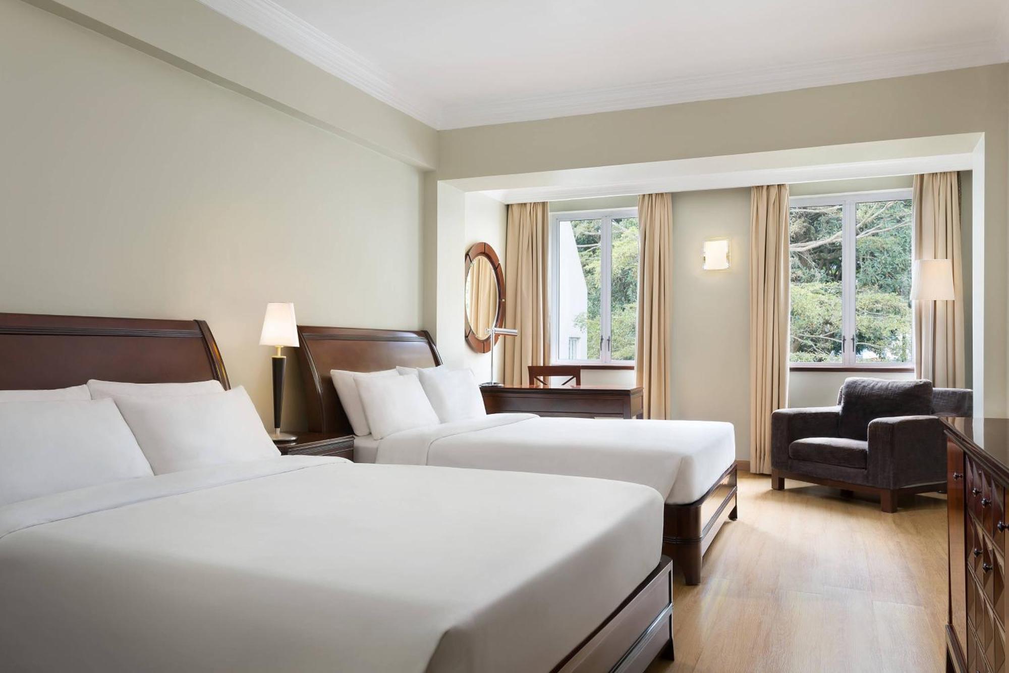 Premium Deluxe Queen Room with Two Queen Beds, Balcony and Garden View