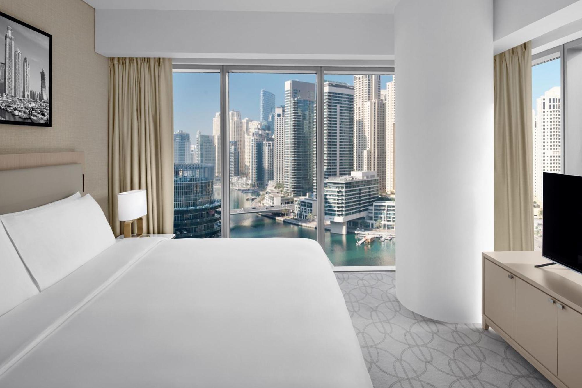Premier Marina View Suite, King bed, Sofa bed, Club lounge access with Breakfast, Lunch & Dinner, 4PM Late checkout, Including direct access to Dubai Marina Mall & Marina Walk