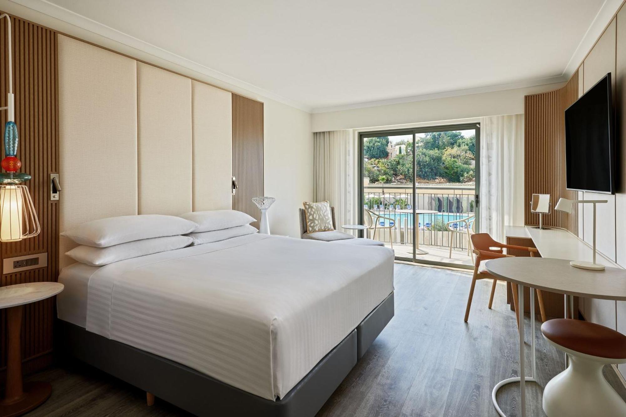 Deluxe Pool View Room 1 King Bed Balcony