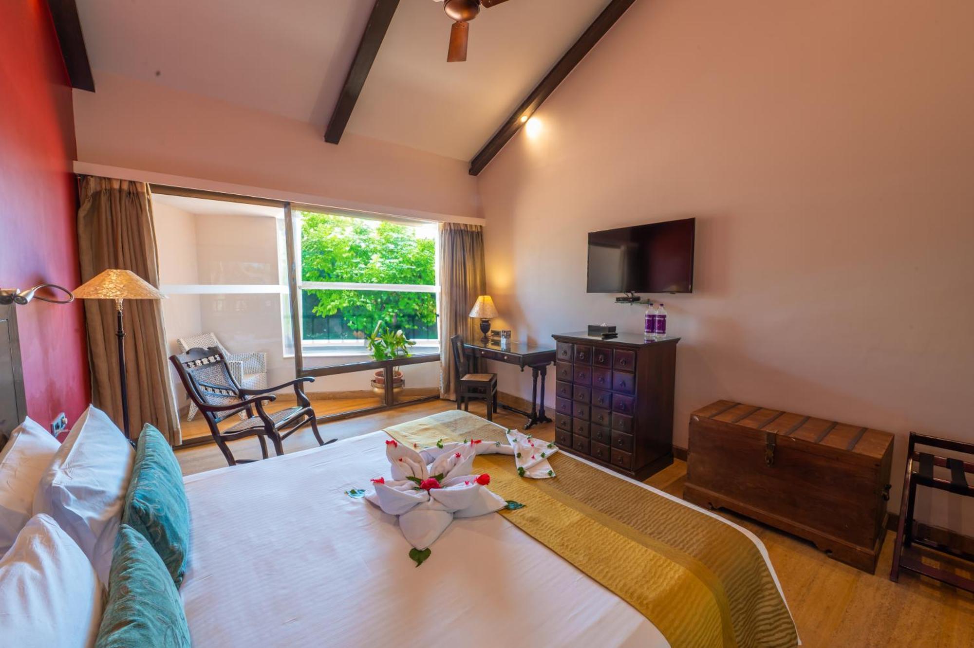 Deluxe Room king bed balcony bathtub