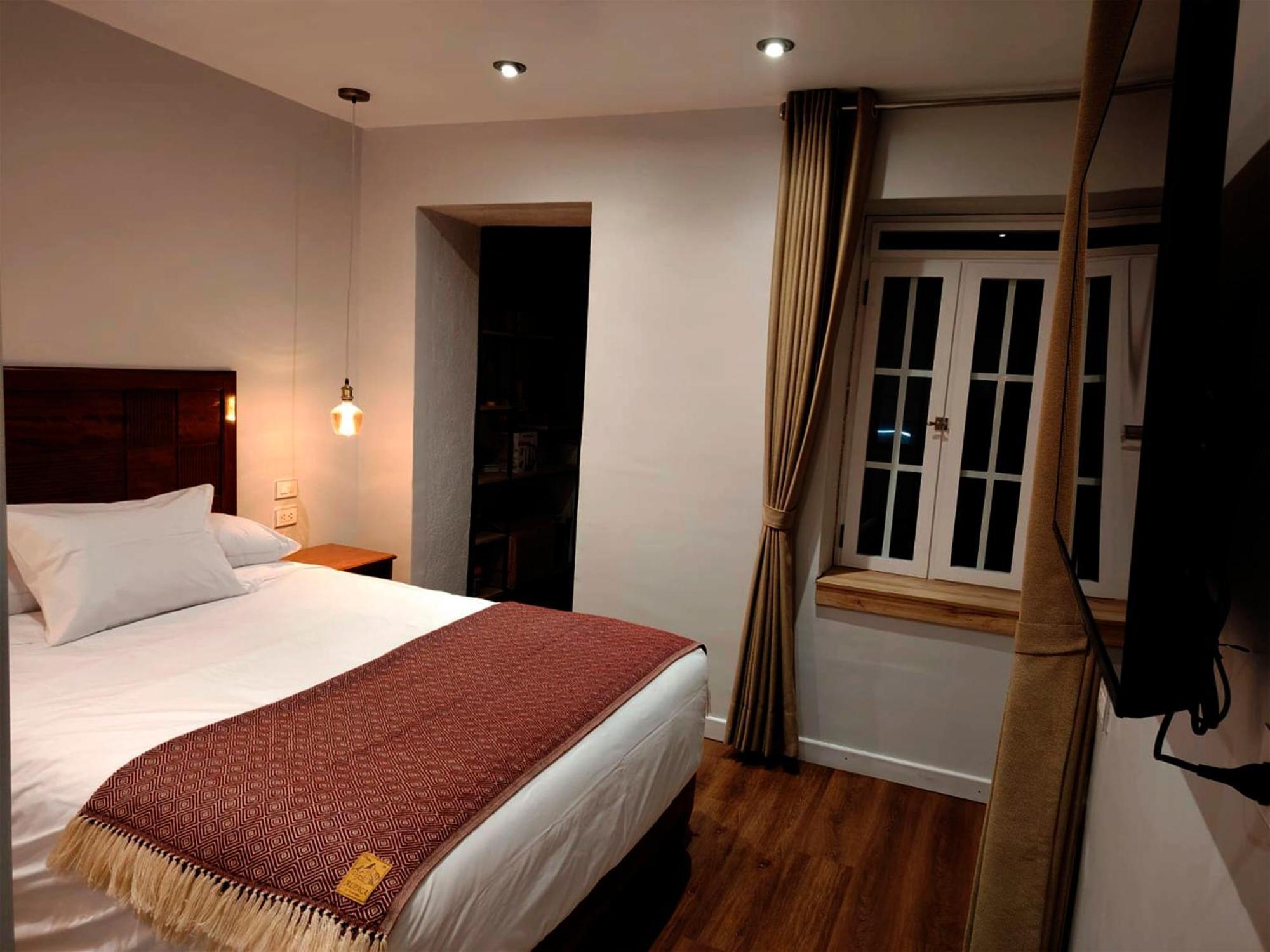 Quarto com Cama Queen-Size e Varanda