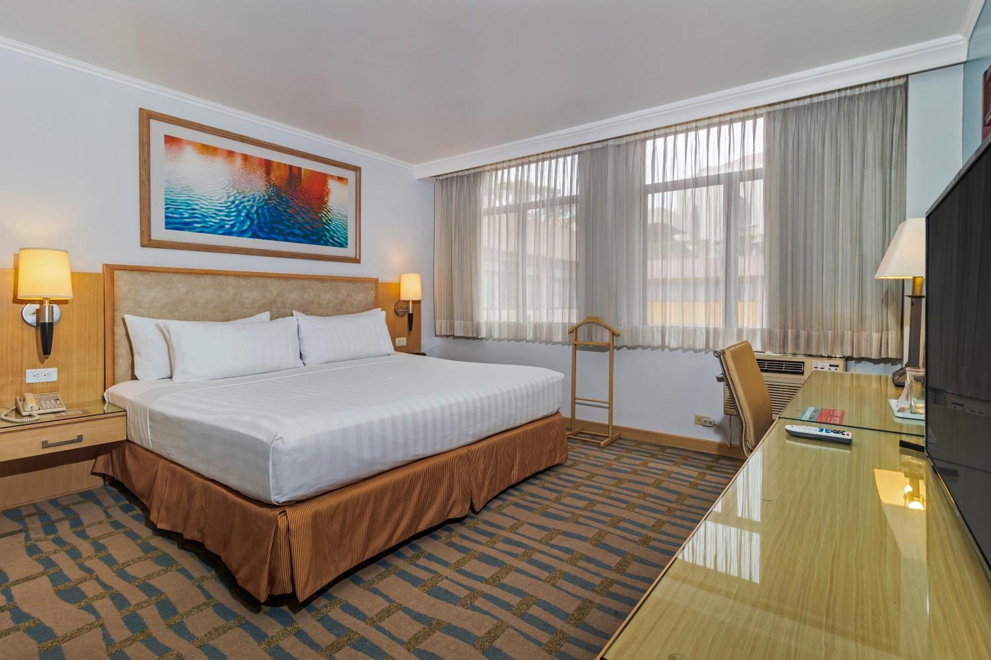 Chambre Lit King-Size Deluxe - Non-Fumeurs