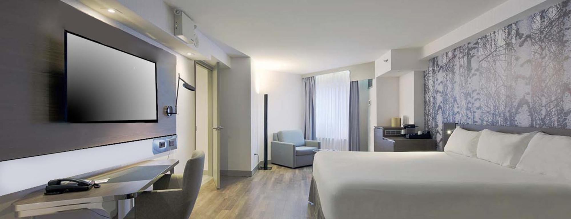 Estudio con cama extragrande y ducha a ras de suelo -Adaptada para personas de movilidad reducida