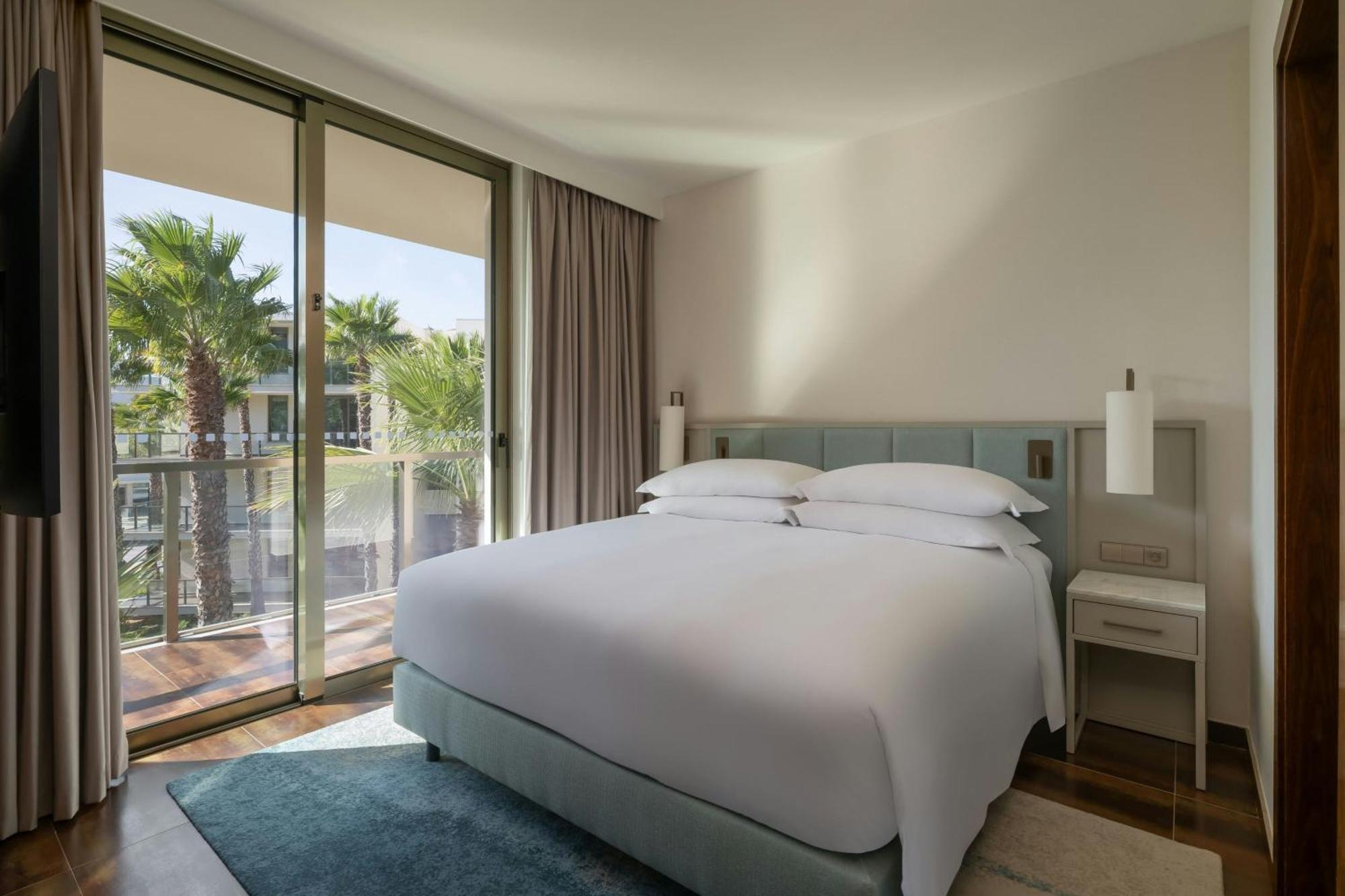 Three-Bedroom Suite with Balcony and Pool View