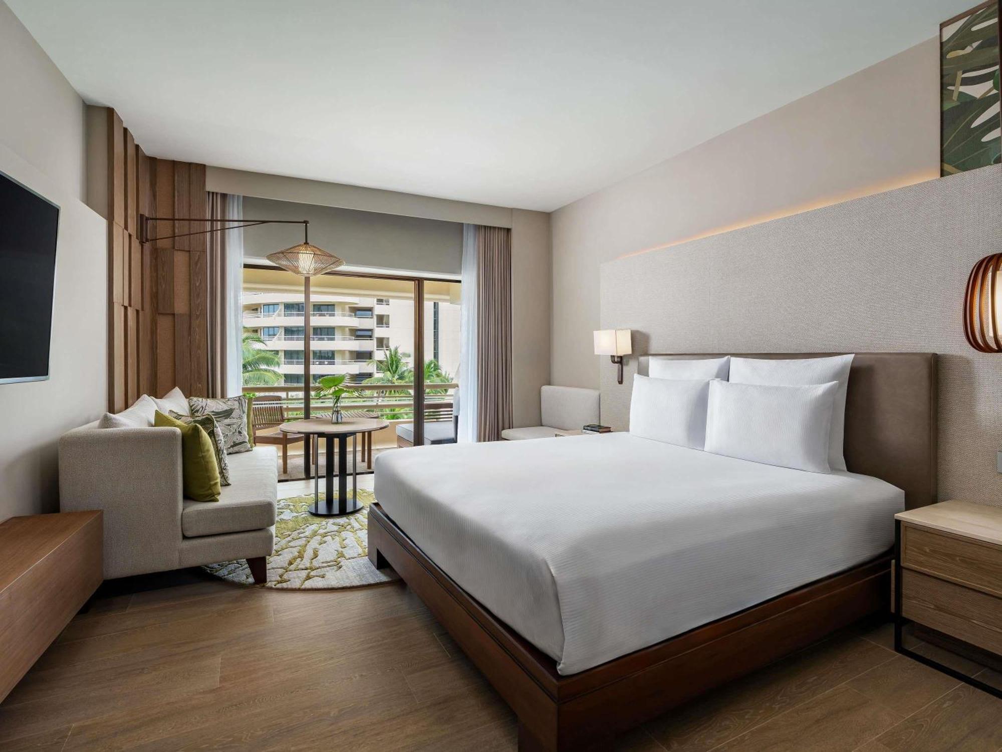 Habitación doble deluxe con cama grande y vistas al jardín