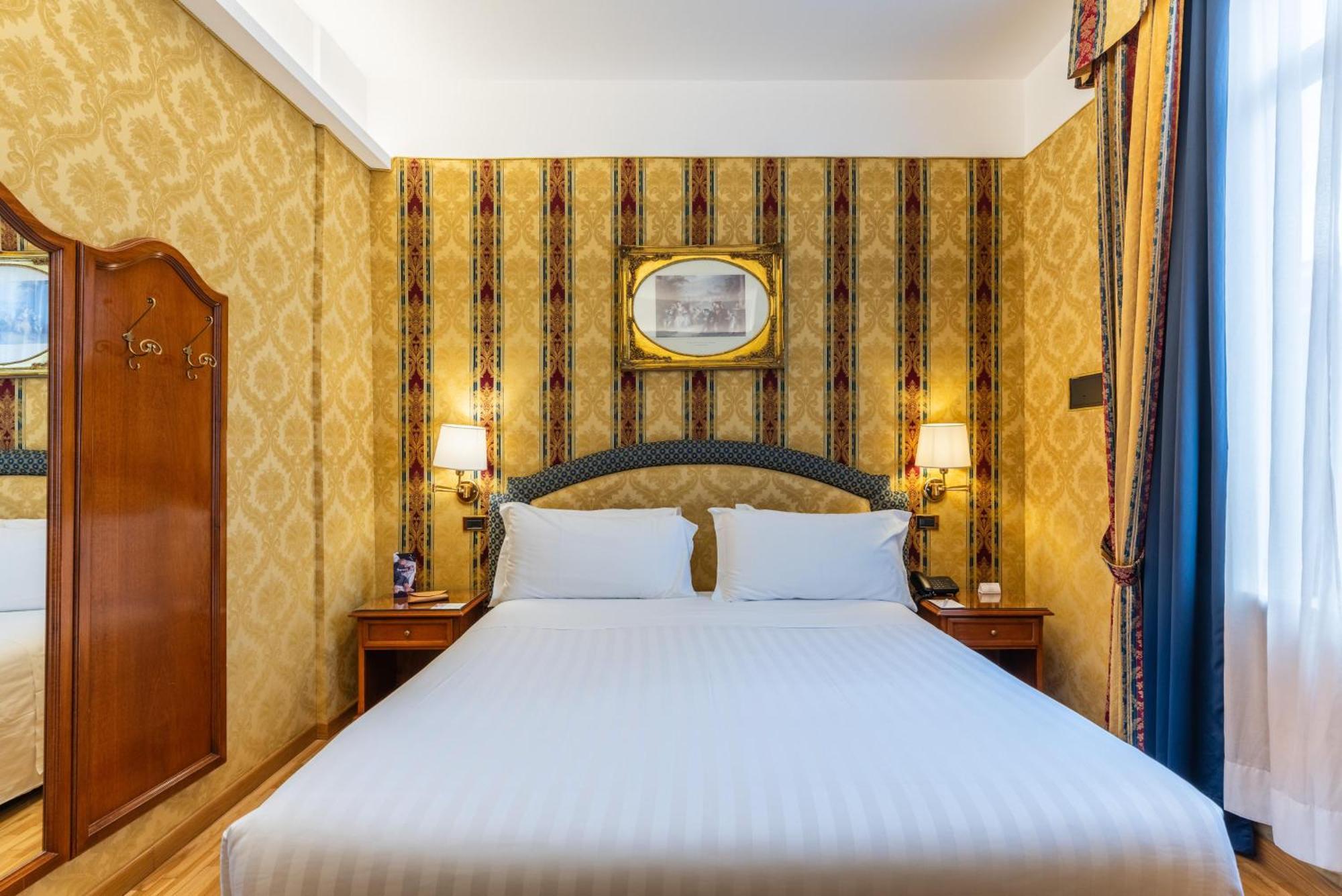 Economy room with double bed and internal window to corridor