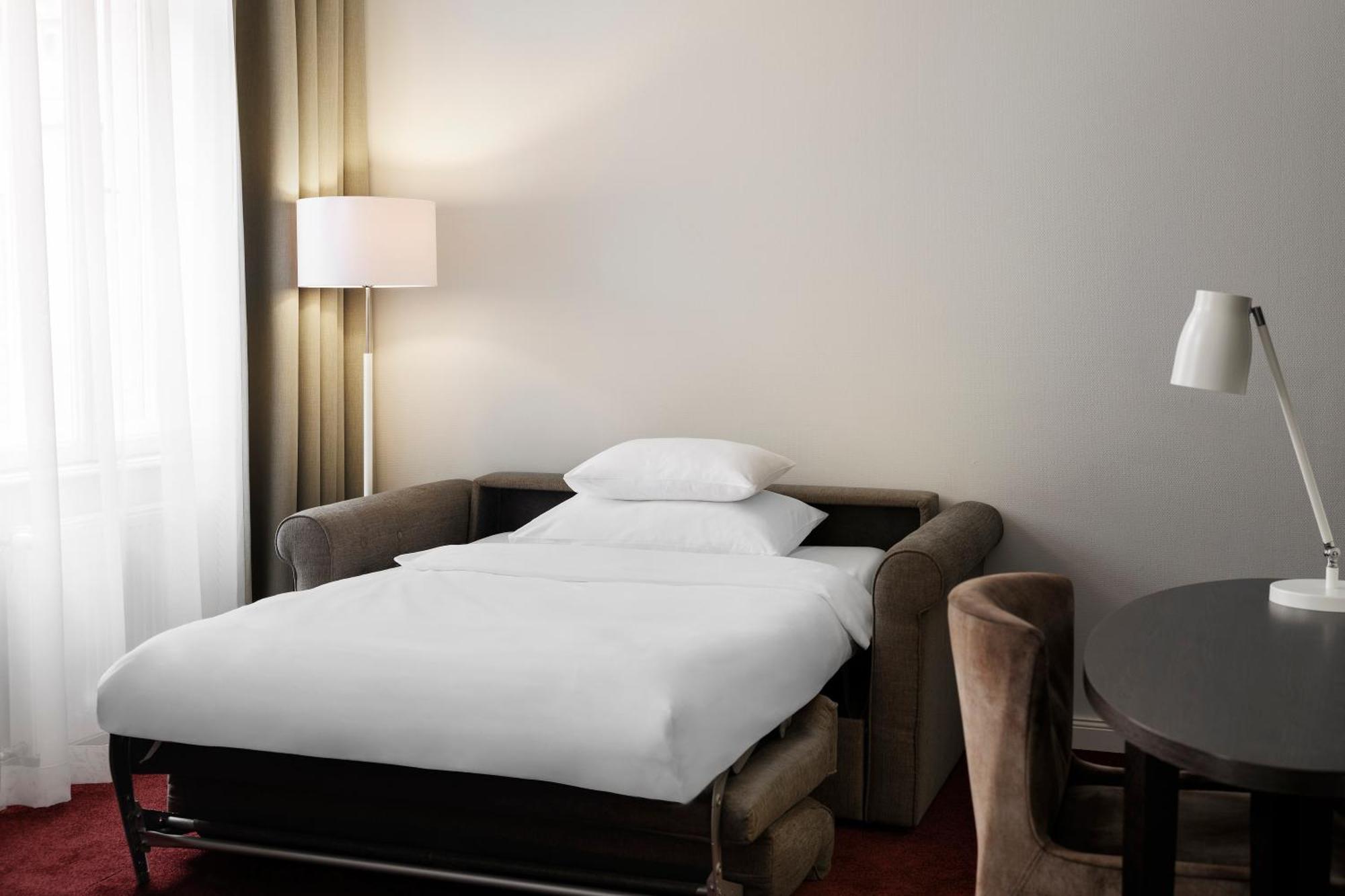 Deluxe Kamer met Queensize Bed en Slaapbank