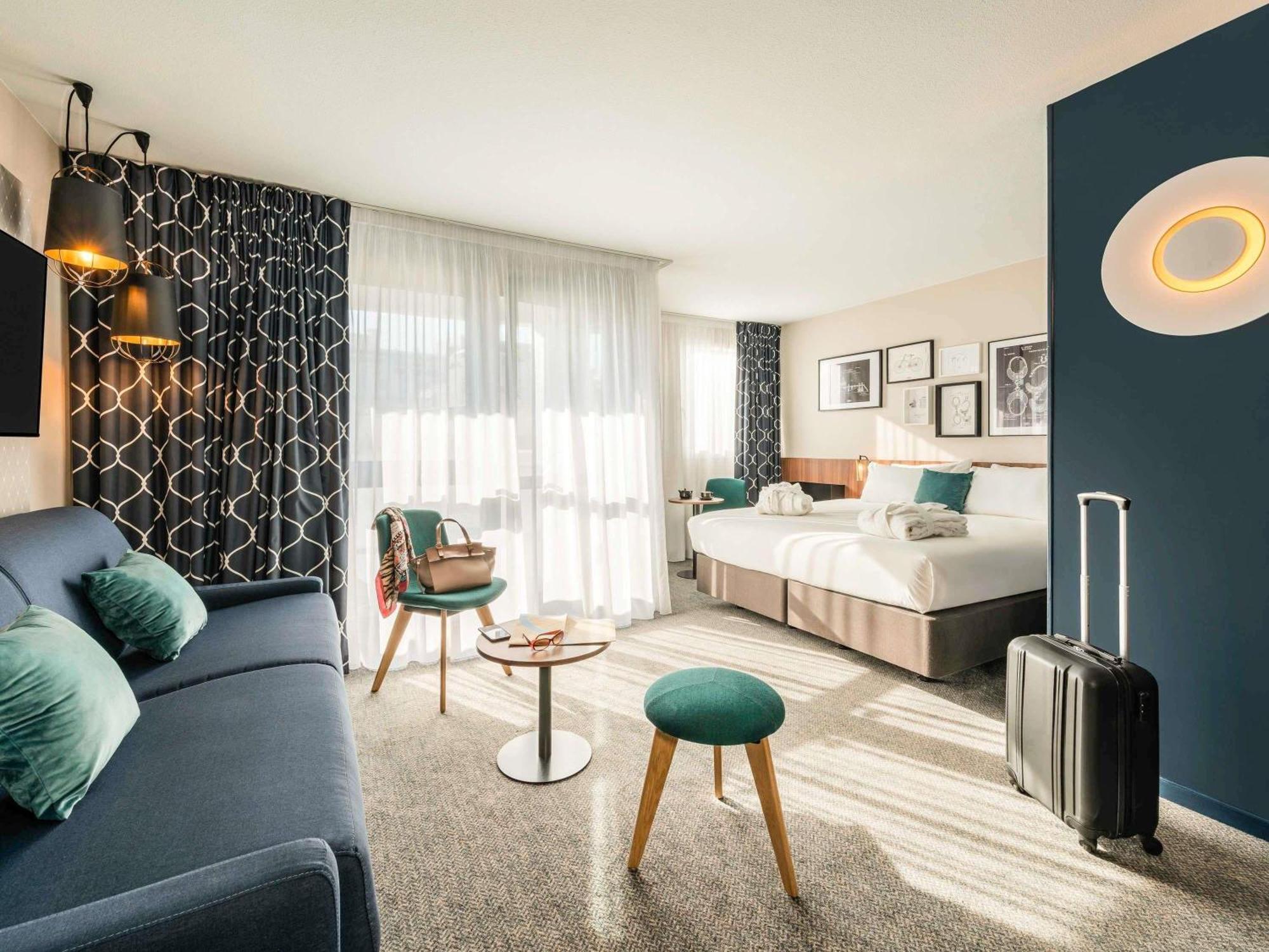 Quarto Superior com Cama Queen-size e Sofá