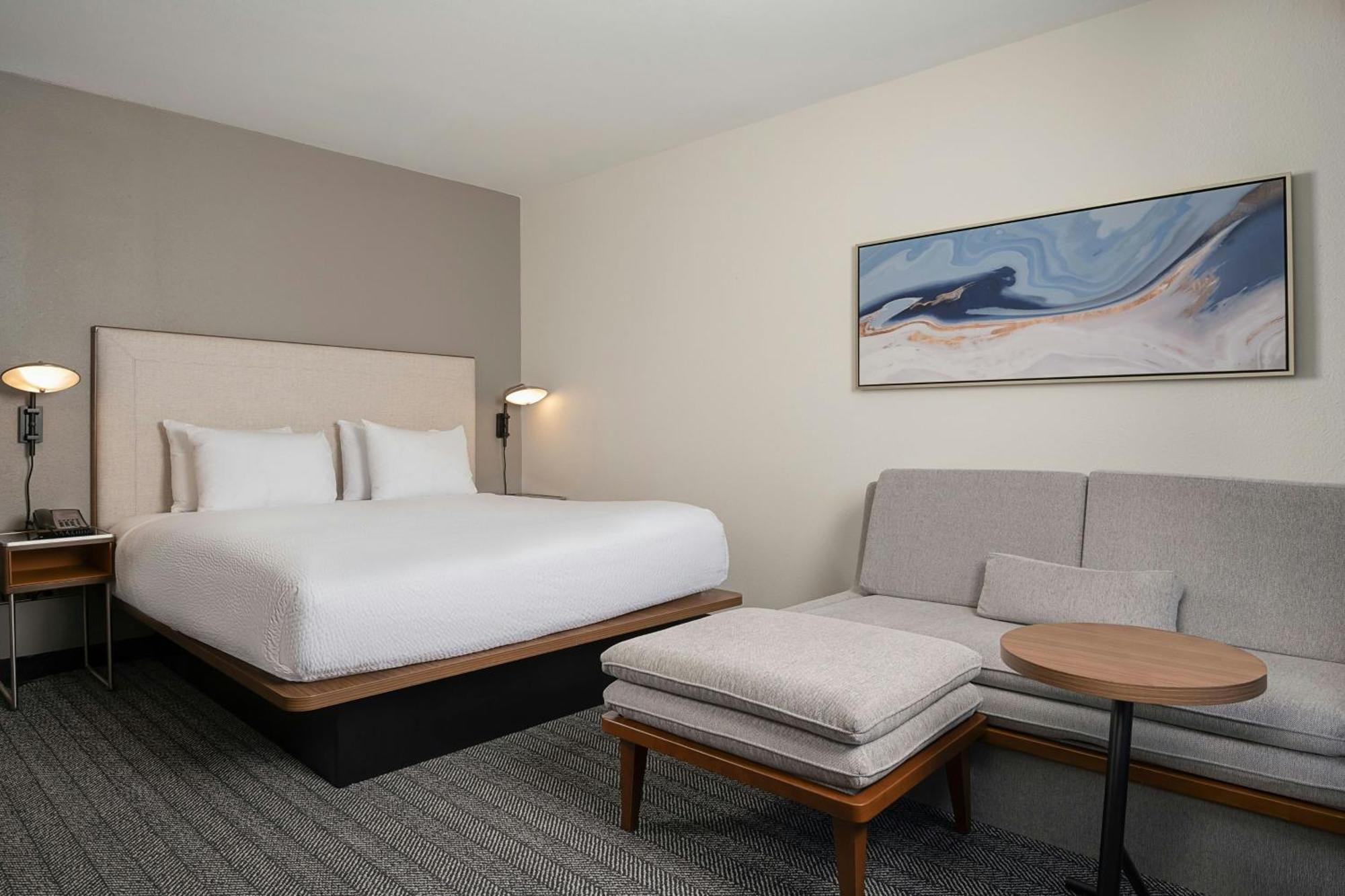 Quarto King com Sofá-cama