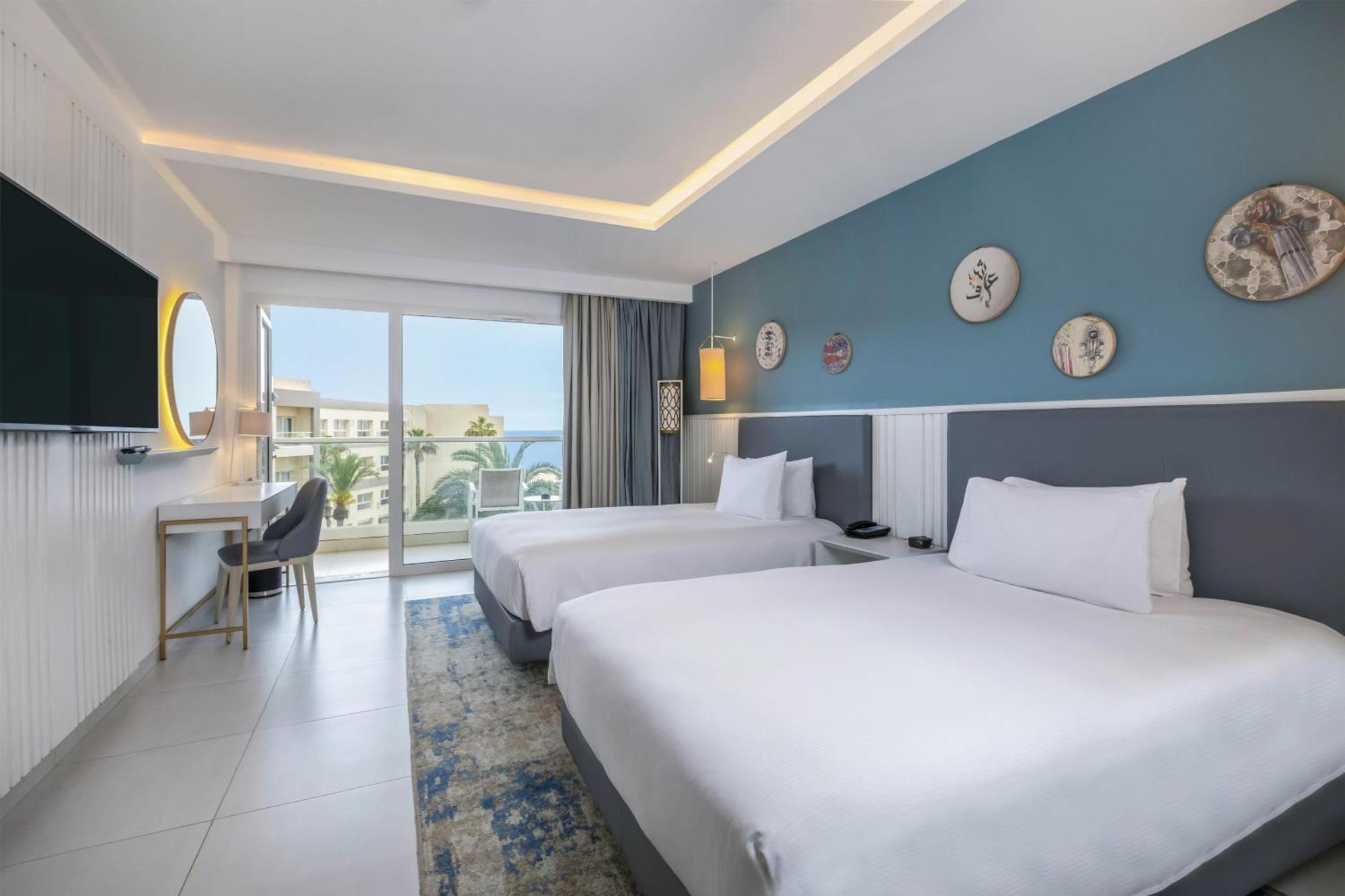Deluxe Double Room Two Double Beds Partial Sea View
