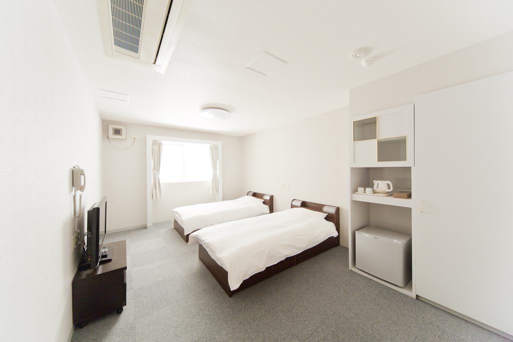 Camera Doppia con Letti Singoli con Letto Supplementare