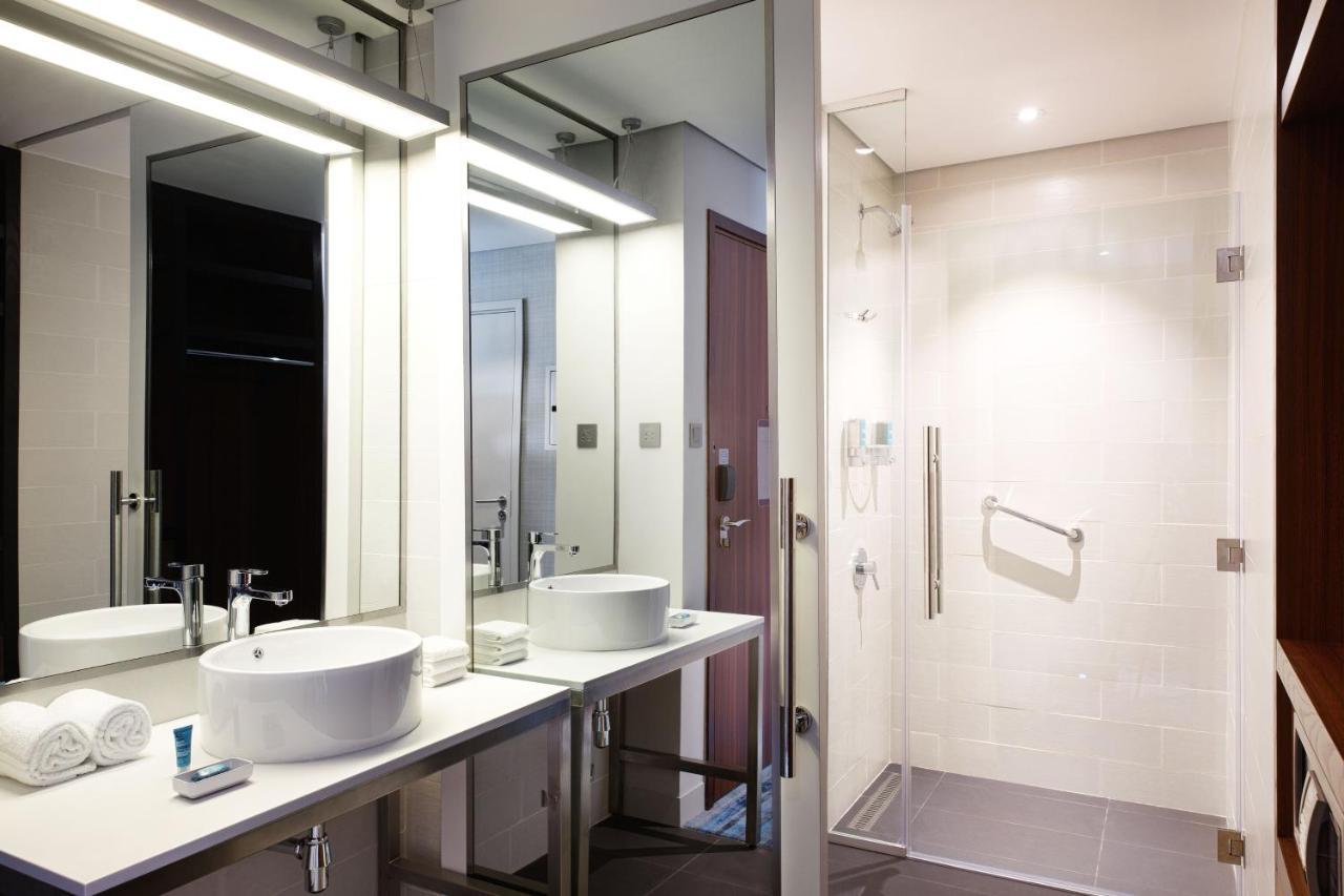 Savvy Suite – King Bed (Living Room + Two Bathrooms + Complimentary Shuttle to Expo Metro Station & Al Maktoum International Airport)